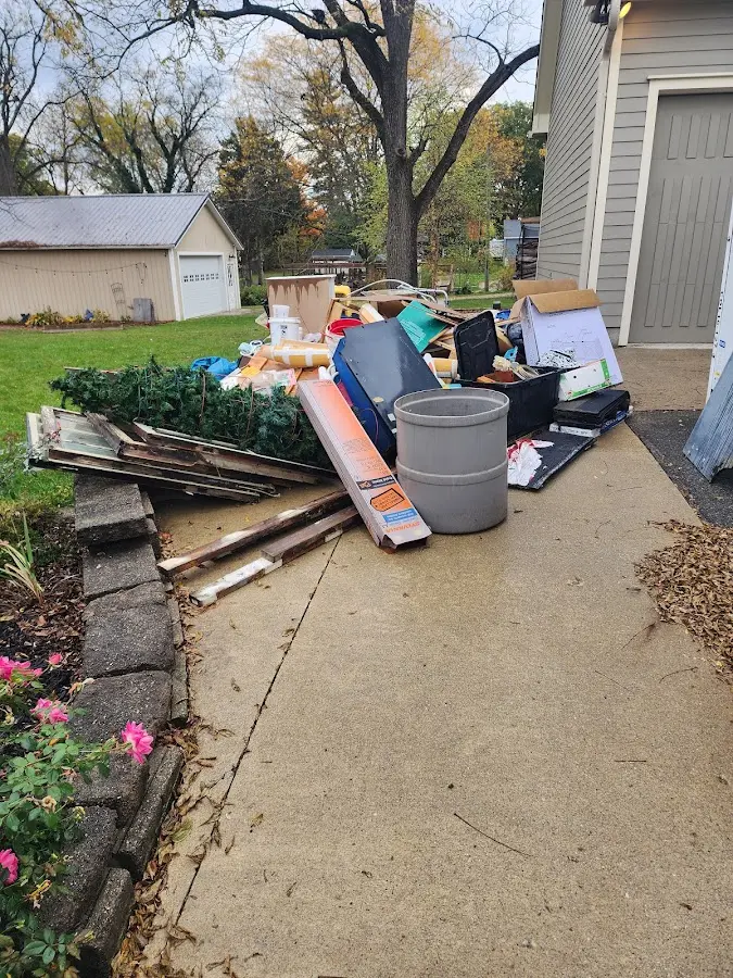Dumpster being loaded with debris for 30 Yard Dumpster Rental in Seaside